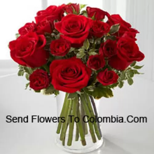 18 Red Colored Roses In A Glass Vase